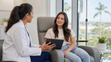 Patient discussing a medically supervised IV hydration appointment with a clinician